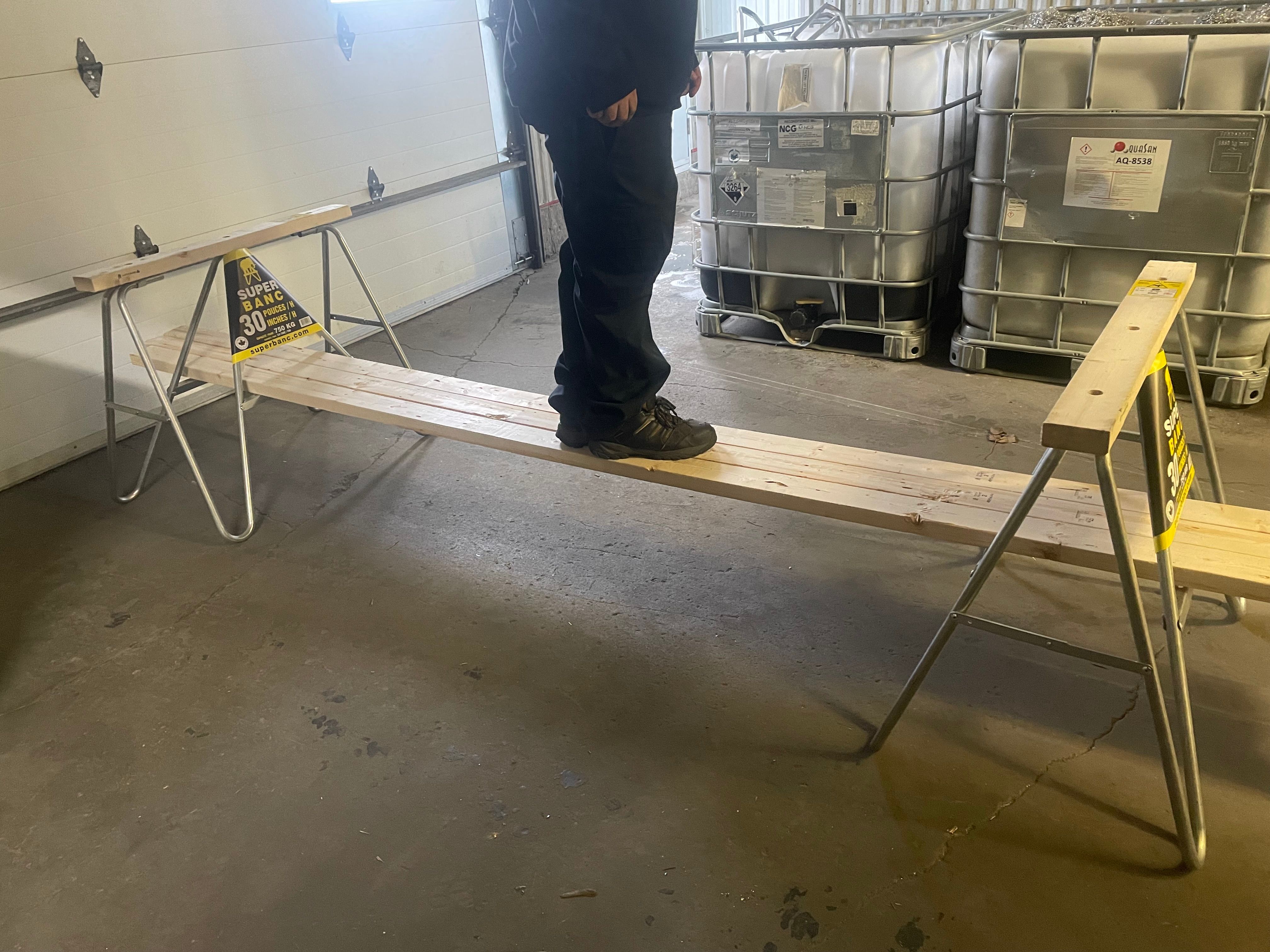 Super Bench sawhorses supporting long pieces of wood